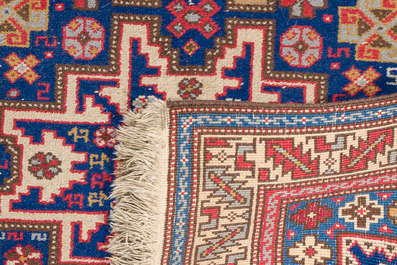An Afghan Shirvan rug with geometric floral design, wool on cotton, mid 20th C.