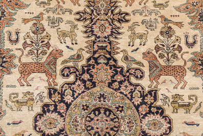 A Persian Qom (Qum/Ghom) silk rug with animals and floral design, 20th C.