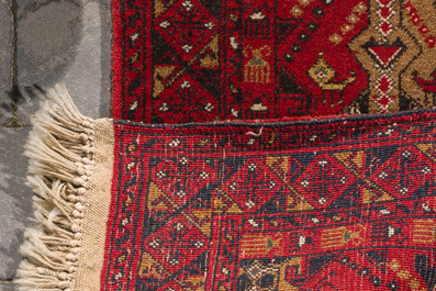 Four oriental rugs (Sarouk, Hamadan and an Afghan carpet), wool on cotton, 20th C.