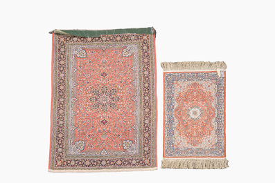 A Persian Qom (Qum/Ghom) silk rug and a Chinese silk Hereke style rug with floral design, 20th C.