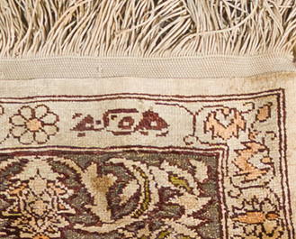 A Turkish Hereke silk rug with gold threads and floral design, 20th C.