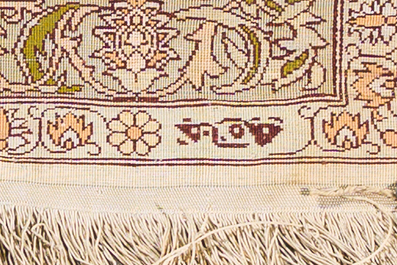 A Turkish Hereke silk rug with gold threads and floral design, 20th C.