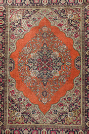 A Persian Qom (Qum/Ghom) silk rug with floral design and a Tabriz rug with animals, 20th C.
