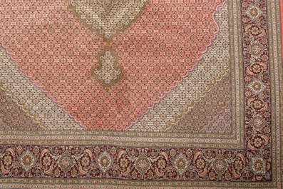 A Persian Tabriz rug with central medallion and floral design, wool on cotton, first half 20th C.