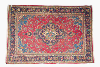 A Persian Mashad rug with central medallion and floral design, wool on cotton, 20th C.