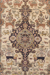 A Persian Qom (Qum/Ghom) silk rug with animals and floral design, 20th C.