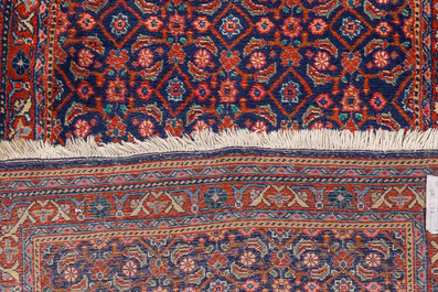 A Persian Sarouk runner with floral design, wool on cotton, first half 20th C.
