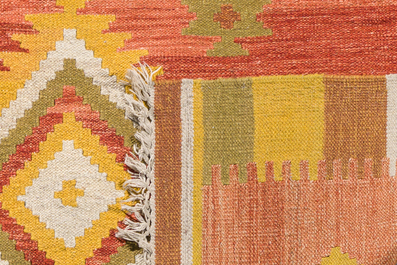 Two Turkish rugs, a.o. a Kilim, wool on cotton, mid 20th C.