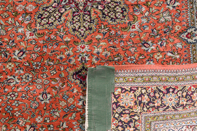 A Persian Qom (Qum/Ghom) silk rug and a Chinese silk Hereke style rug with floral design, 20th C.