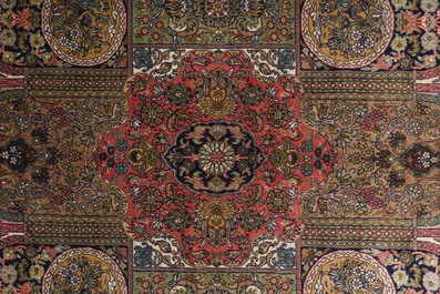 An extremely fine Chinese Hereke style silk rug with floral design, 20th C.