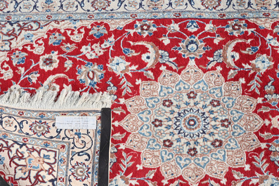 A Persian Nain rug with floral design, wool and silk on cotton, 20th C.
