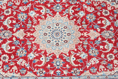 A Persian Nain rug with floral design, wool and silk on cotton, 20th C.
