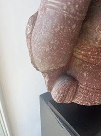 An Indian yellow-speckled red sandstone relief of a devata, probably Mathura school, Kushan period 2nd C. b.C./2nd C.