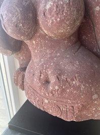 An Indian yellow-speckled red sandstone relief of a devata, probably Mathura school, Kushan period 2nd C. b.C./2nd C.