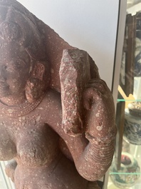 An Indian yellow-speckled red sandstone relief of a devata, probably Mathura school, Kushan period 2nd C. b.C./2nd C.