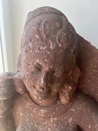 An Indian yellow-speckled red sandstone relief of a devata, probably Mathura school, Kushan period 2nd C. b.C./2nd C.
