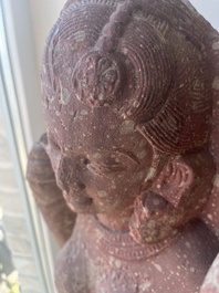 An Indian yellow-speckled red sandstone relief of a devata, probably Mathura school, Kushan period 2nd C. b.C./2nd C.