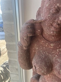 An Indian yellow-speckled red sandstone relief of a devata, probably Mathura school, Kushan period 2nd C. b.C./2nd C.