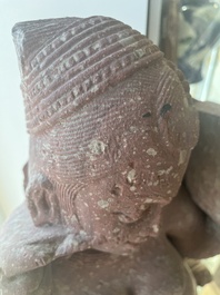 An Indian yellow-speckled red sandstone relief of a devata, probably Mathura school, Kushan period 2nd C. b.C./2nd C.