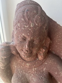 An Indian yellow-speckled red sandstone relief of a devata, probably Mathura school, Kushan period 2nd C. b.C./2nd C.