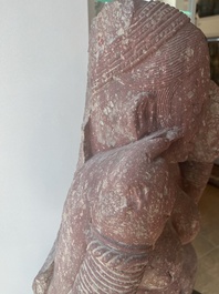 An Indian yellow-speckled red sandstone relief of a devata, probably Mathura school, Kushan period 2nd C. b.C./2nd C.