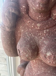 An Indian yellow-speckled red sandstone relief of a devata, probably Mathura school, Kushan period 2nd C. b.C./2nd C.