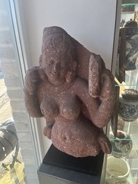 An Indian yellow-speckled red sandstone relief of a devata, probably Mathura school, Kushan period 2nd C. b.C./2nd C.