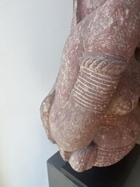 An Indian yellow-speckled red sandstone relief of a devata, probably Mathura school, Kushan period 2nd C. b.C./2nd C.