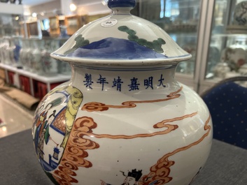 A Chinese wucai 'narrative subject' vase and cover, Wanli mark, 19th C.
