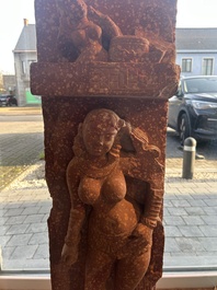 A large Indian red sandstone stupa pillar with a devata shown as a woman and lotus flowers, probably Matura region, ca. 2nd C. b.C - 2nd C.