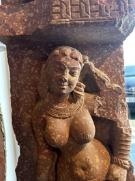 A large Indian red sandstone stupa pillar with a devata shown as a woman and lotus flowers, probably Matura region, ca. 2nd C. b.C - 2nd C.