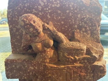 A large Indian red sandstone stupa pillar with a devata shown as a woman and lotus flowers, probably Matura region, ca. 2nd C. b.C - 2nd C.