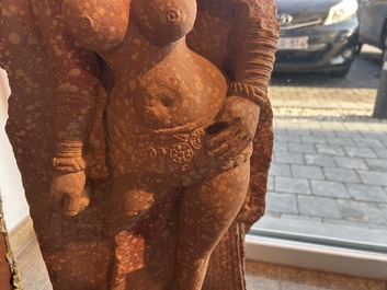 A large Indian red sandstone stupa pillar with a devata shown as a woman and lotus flowers, probably Matura region, ca. 2nd C. b.C - 2nd C.