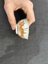 A Chinese iron-red and gilt 'Sanguozhi yanyi' cup and saucer, Yongzheng