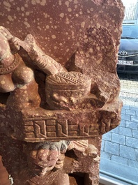 A large Indian red sandstone stupa pillar with a devata shown as a woman and lotus flowers, probably Matura region, ca. 2nd C. b.C - 2nd C.