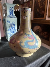 A Chinese famille rose enamelled teadust-glazed bottle vase with dragons, Qianlong mark, 19th C.