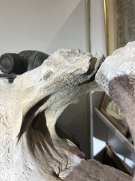 A large whale vertebra mounted on a wooden base, s.d.