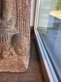 A large Indian red sandstone stupa pillar with a devata shown as a woman and lotus flowers, probably Matura region, ca. 2nd C. b.C - 2nd C.
