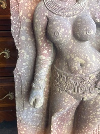 A large Indian red sandstone stupa pillar with a devata shown as a woman and lotus flowers, probably Matura region, ca. 2nd C. b.C - 2nd C.