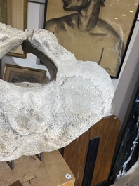 A large whale vertebra mounted on a wooden base, s.d.
