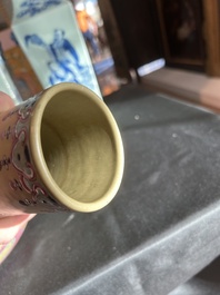 A Chinese famille rose enamelled teadust-glazed bottle vase with dragons, Qianlong mark, 19th C.