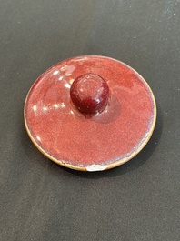 A Chinese monochrome oxblood-glazed bottle vase and a jar and cover, 19th C.