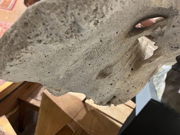 A large whale vertebra mounted on a wooden base, s.d.