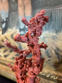 A Chinese red coral group of birds among blossoming branches on a silver-inlaid wooden stand, 19th/20th C.