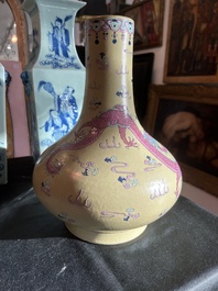 A Chinese famille rose enamelled teadust-glazed bottle vase with dragons, Qianlong mark, 19th C.