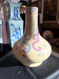 A Chinese famille rose enamelled teadust-glazed bottle vase with dragons, Qianlong mark, 19th C.