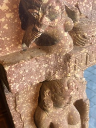 A large Indian red sandstone stupa pillar with a devata shown as a woman and lotus flowers, probably Matura region, ca. 2nd C. b.C - 2nd C.