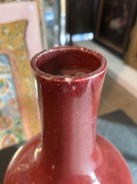 A Chinese monochrome oxblood-glazed bottle vase and a jar and cover, 19th C.