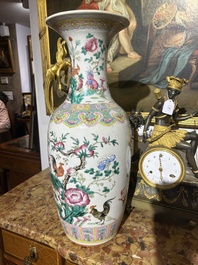 A Chinese famille rose vase with roosters among blossoming branches, 19th C.