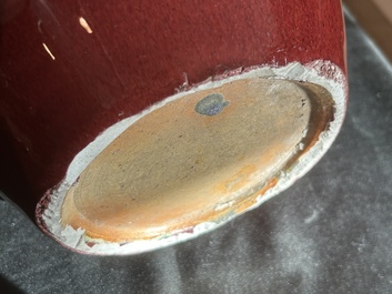 A Chinese monochrome oxblood-glazed bottle vase and a jar and cover, 19th C.